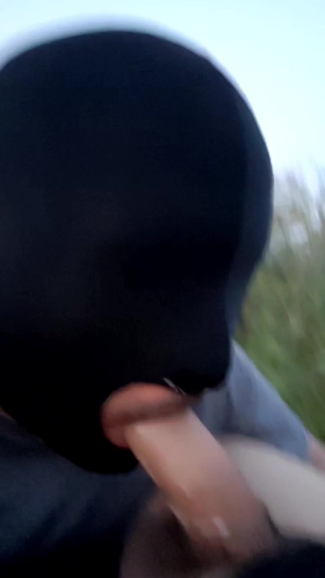 Masked slave sucking cock